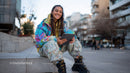 Young Woman Sitting on Urban Steps Using Tablet in Casual Streetwear