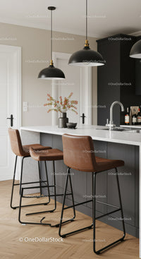 Modern Kitchen with Brown Leather Bar Stools and Pendant Lights