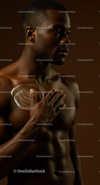 Young African Man Applying Lotion for Skincare Routine