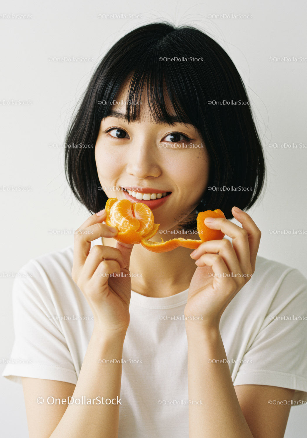 Young Woman Holding Tangerine Peel and Segments with Bright Smile