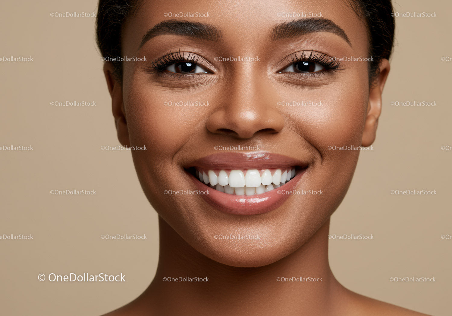 Closeup of smiling woman with flawless glowing skin