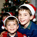 Happy boys wearing Santa hats during Christmas celebration