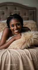 Smiling woman relaxing on cozy bed with fluffy pillow
