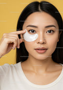 Young Woman Applying Eye Mask for Skin Rejuvenation and Beauty