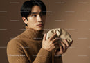 Young Man in Beige Turtleneck Sweater with Neutral Background