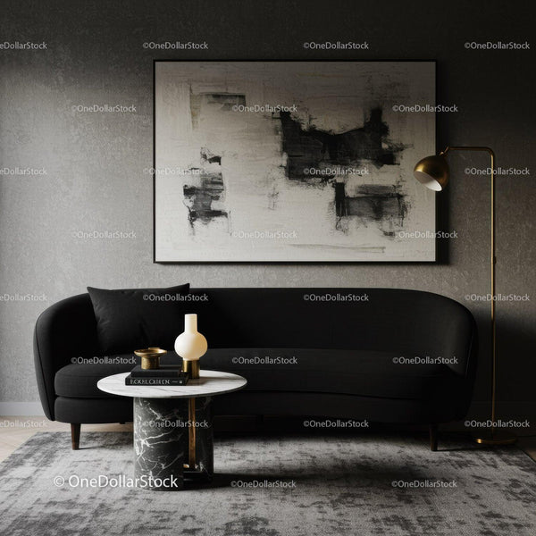 Modern living room with black sofa and abstract art