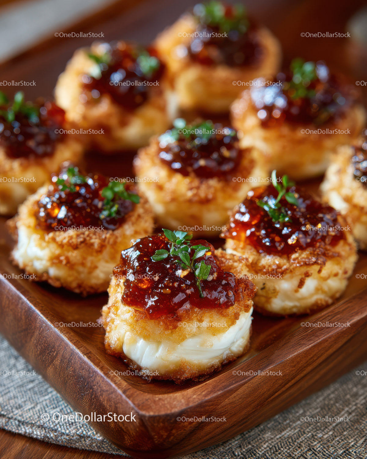 Gourmet Crostini with Cheese and Red Pepper Jelly on Rustic Platter