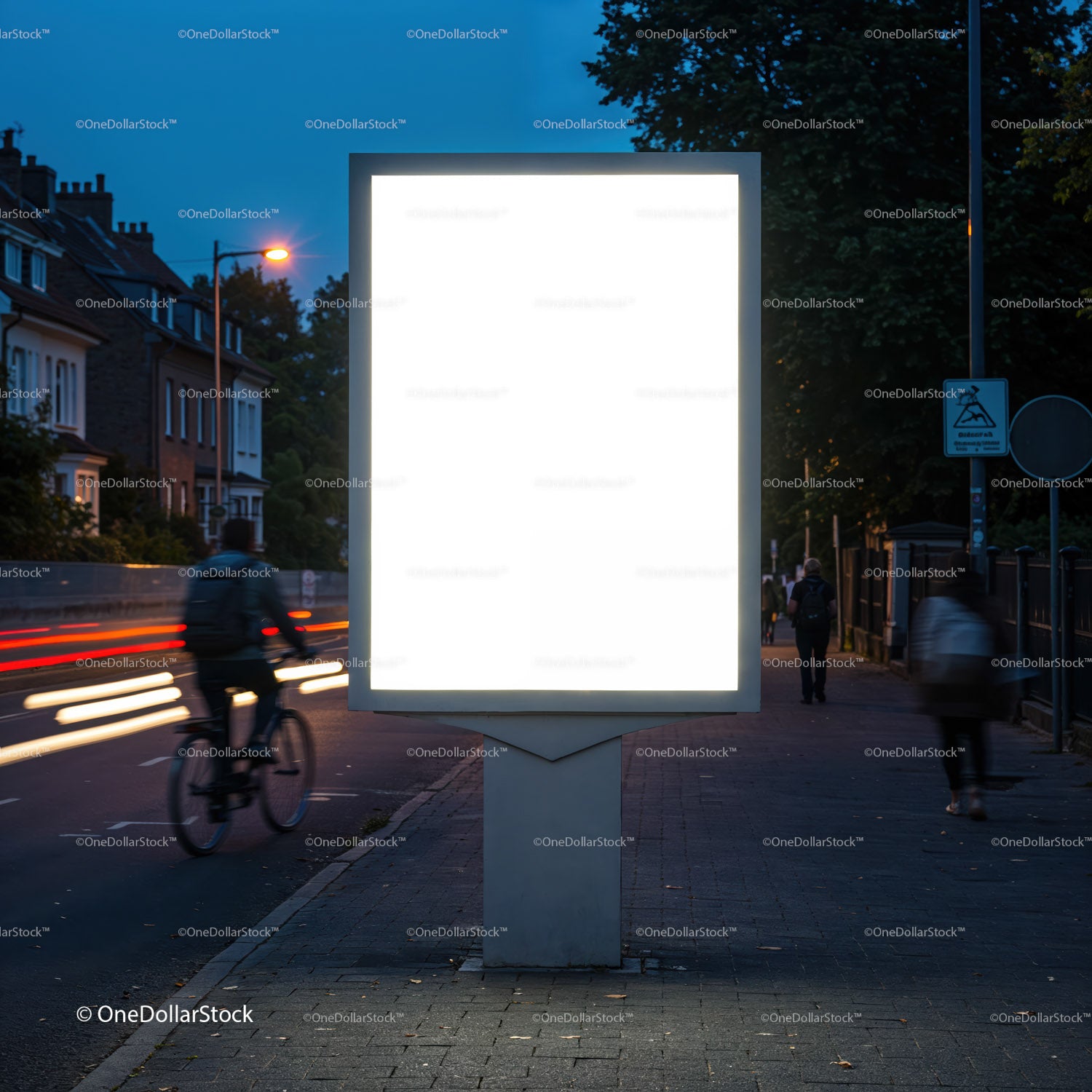 Empty illuminated billboard on urban street at dusk