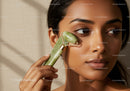 Young Woman Using Jade Roller for Facial Skincare Relaxation