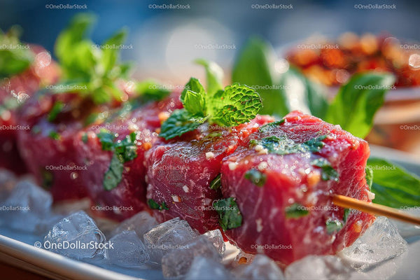 Fresh Beef Skewers with Mint Leaves on Ice for Summer Grilling