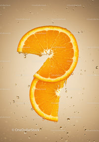 Fresh orange slices suspended in sparkling water bubbles