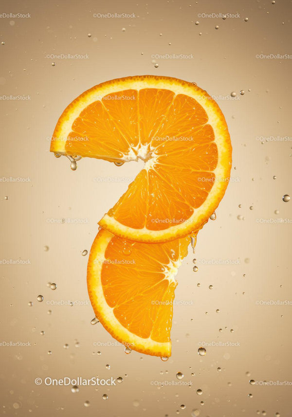 Fresh orange slices suspended in sparkling water bubbles