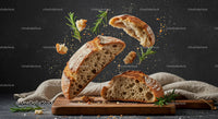 Rustic sourdough bread with fresh rosemary on board
