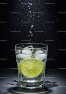 Refreshing glass of sparkling water with lime slice