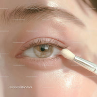 Close-Up of Eye with Makeup Brush Applying Eyeshadow