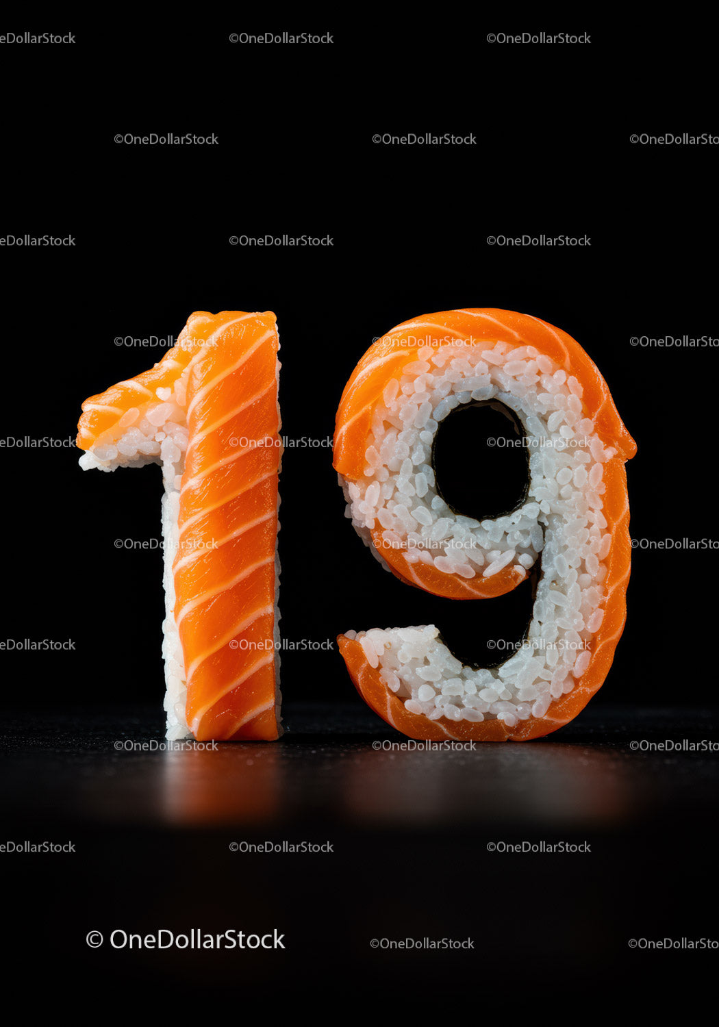 Number nineteen shaped from sushi rice and salmon slices