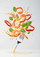 Fresh shrimp salad ingredients flying with fork