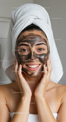 Woman with Black Clay Facial Mask in Spa Setting