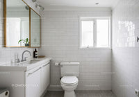 Minimalist White Bathroom with Natural Light and Modern Decor