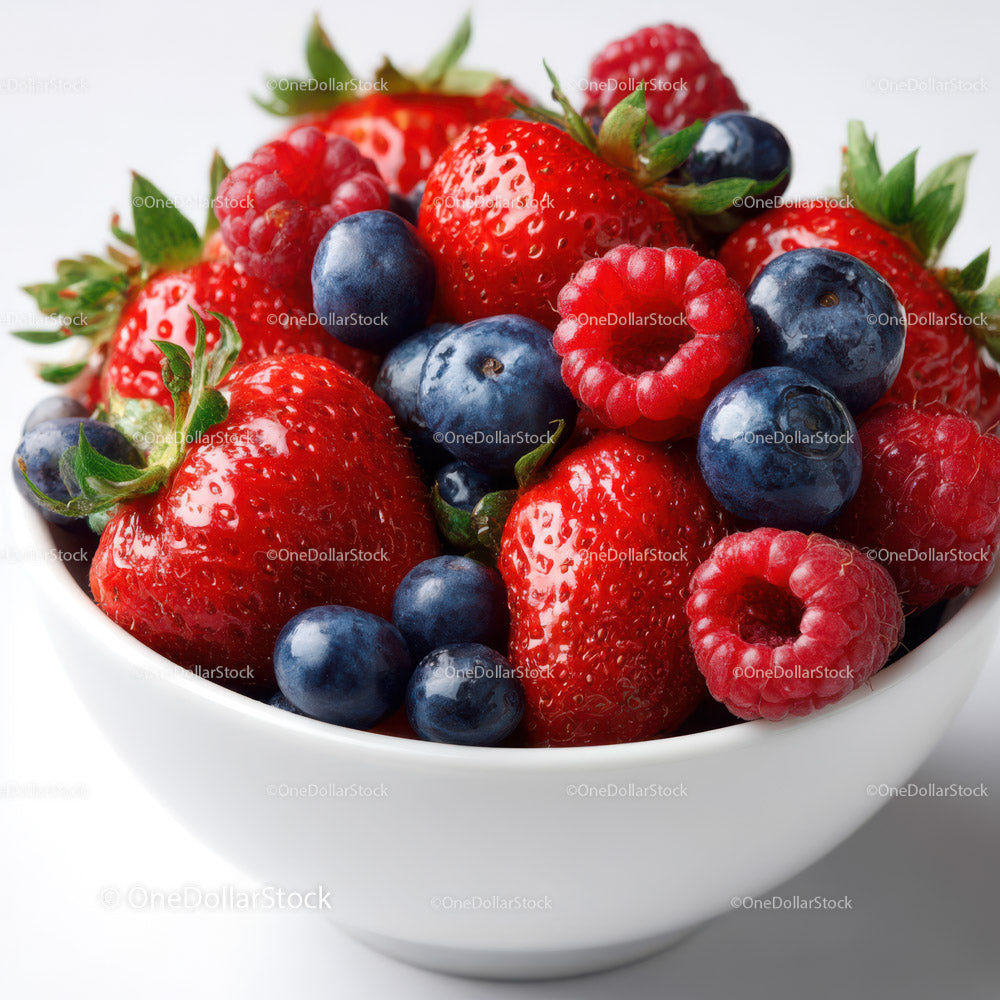 Fresh Mixed Berries in a White Bowl with Green Leaves
