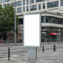 Empty Urban Billboard on City Sidewalk Displaying Blank Space