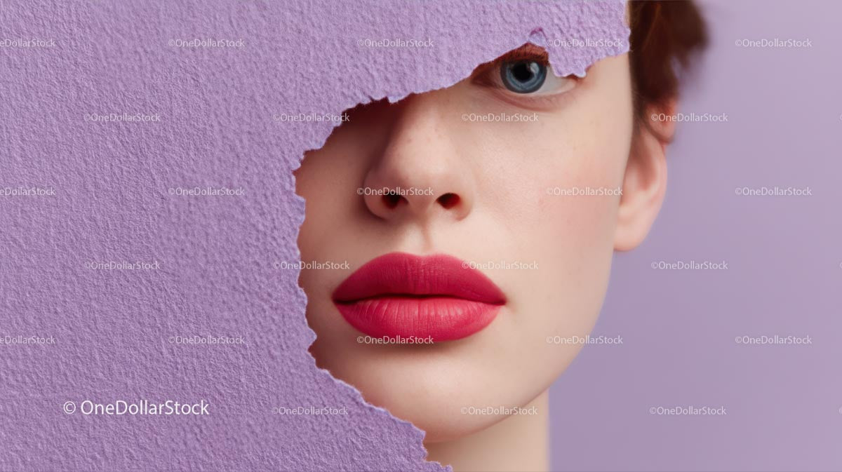 Beautiful Woman with Radiant Pink Lips and Artistic Background