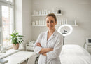 Confident Female Doctor in White Coat in Modern Medical Clinic