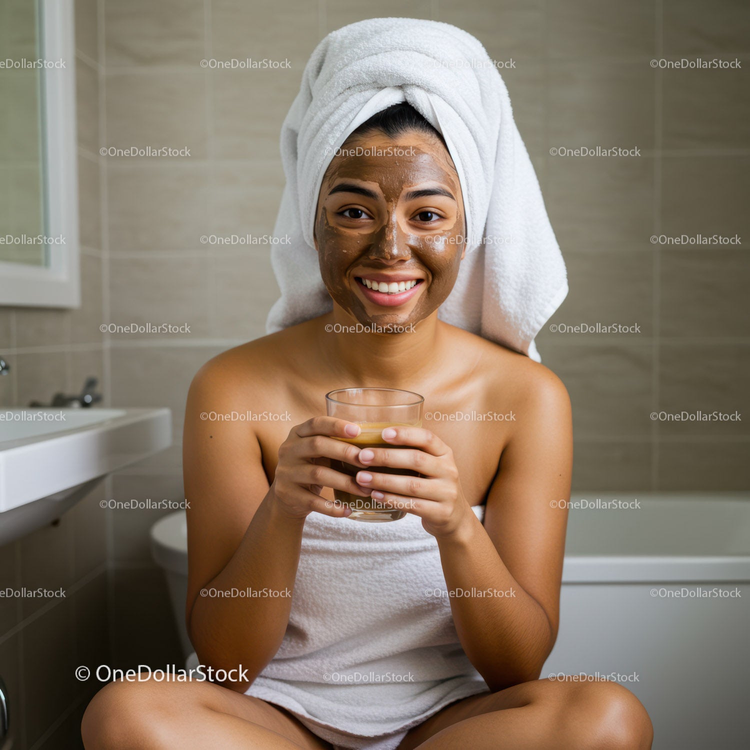 Young Woman with Facial Mask Relaxing and Drinking in Bathroom