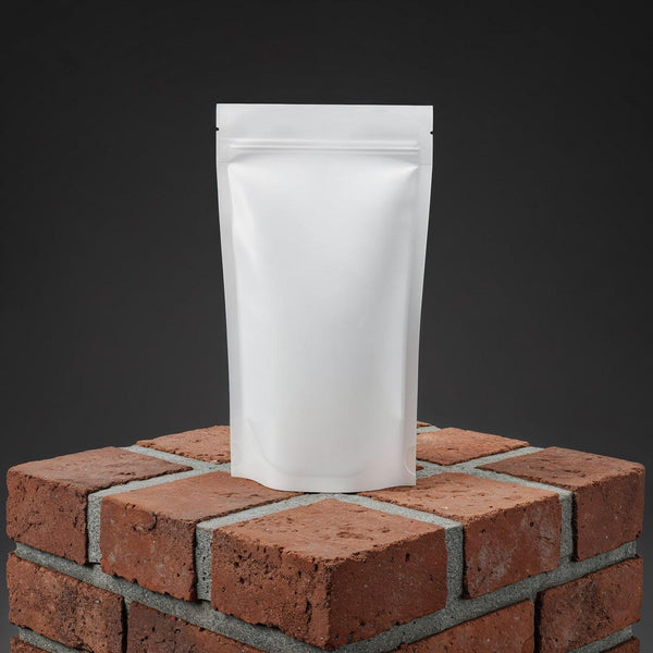 Minimalist white pouch on textured brick pedestal JPG Mockup Image