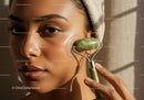 Woman Receiving Facial Massage with Jade Roller Highlighting Clear Skin
