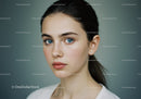 Portrait of a Young Woman with Bright Blue Eyes and Clear Skin