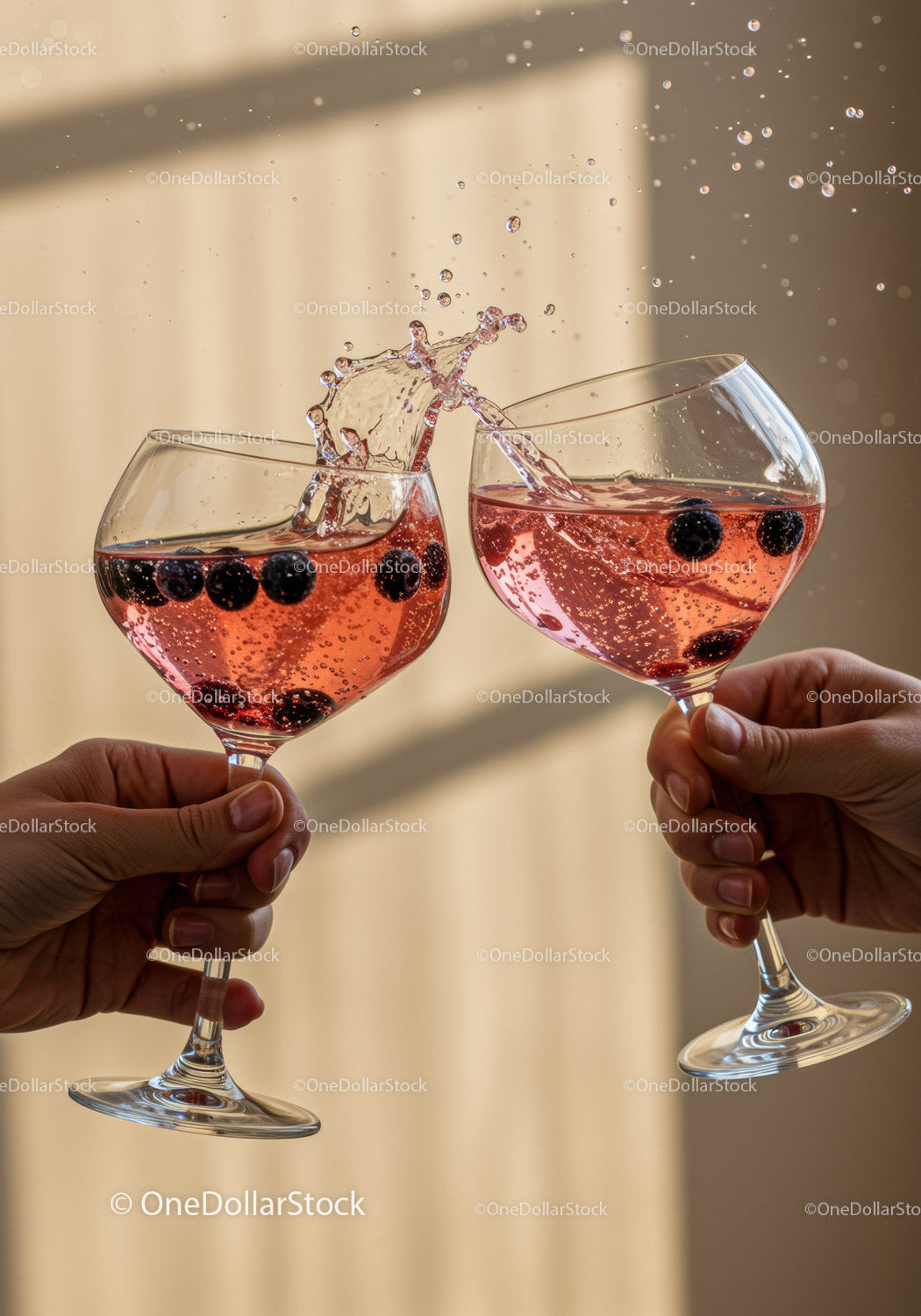 Two people clinking glasses with berry sparkling drinks