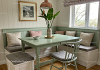 Bright and Airy Kitchen Nook with Built-In Window Bench and Large Houseplant