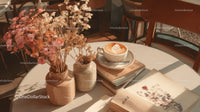 Stylish Coffee Table with Dried Flowers and Open Books in Cozy Cafe