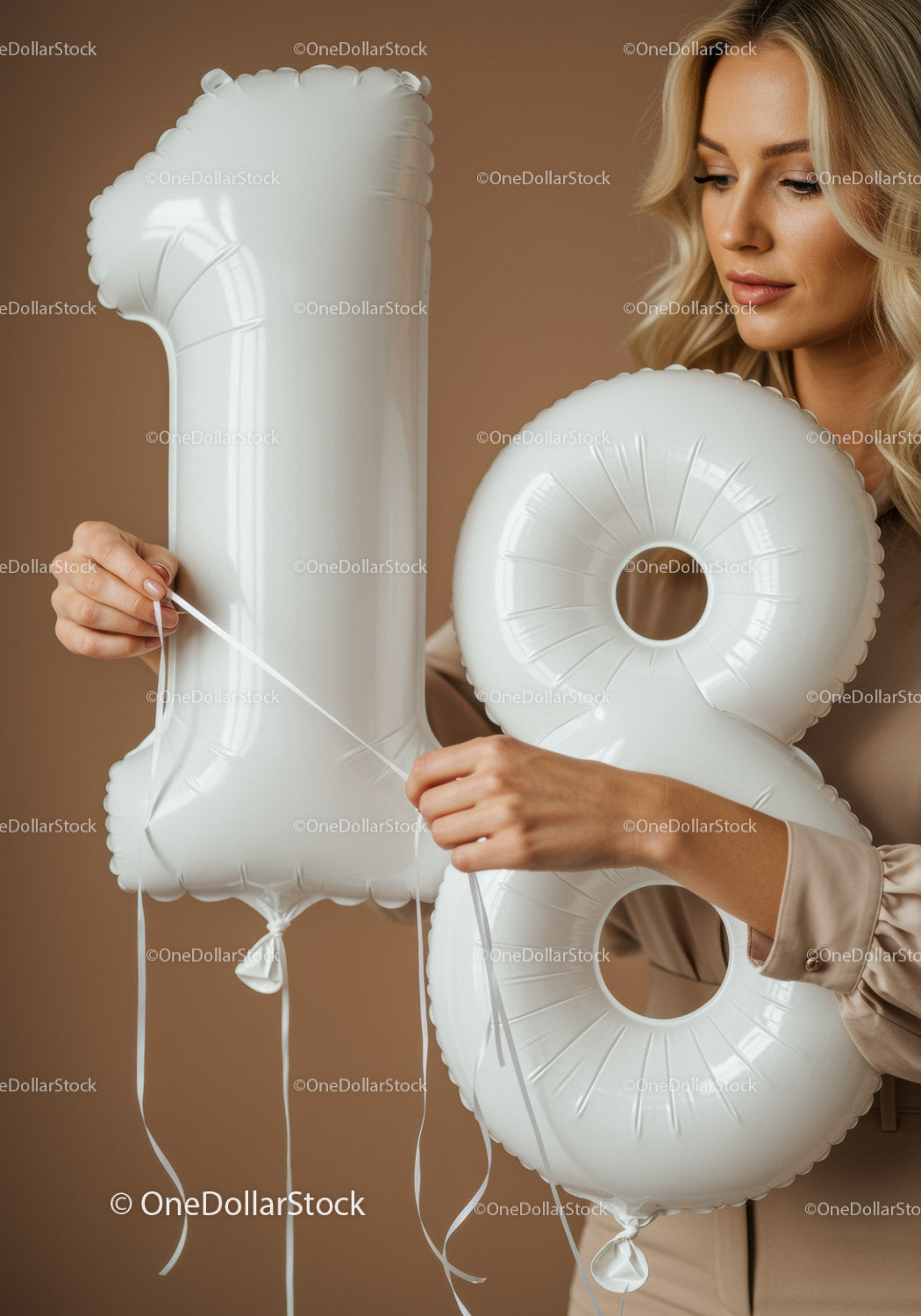 Blonde woman holding white number 18 balloons