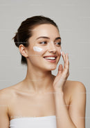 Young Woman Applying Facial Moisturizer for Healthy Glowing Skin