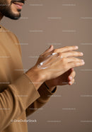 Close-Up of Man Applying Body Lotion for Skincare and Wellness