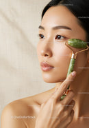 Young Woman Using Jade Roller for Facial Massage and Skin Rejuvenation