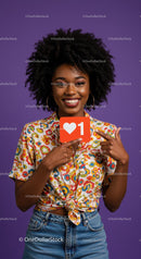 Vibrant Smiling Woman in Colorful Shirt Holding Like Icon Sign