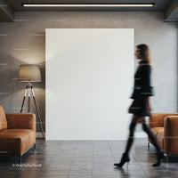 Blurred woman walking through modern lobby with leather sofas
