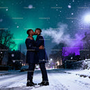 Romantic kiss between couple on snowy winter street