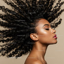 Profile of woman with voluminous curly hair and flawless skin