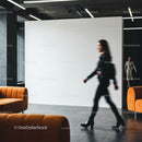 Blurred businesswoman walking in modern office lobby