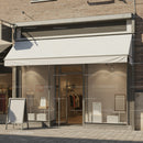 Minimalist fashion store with white canopy and window displays