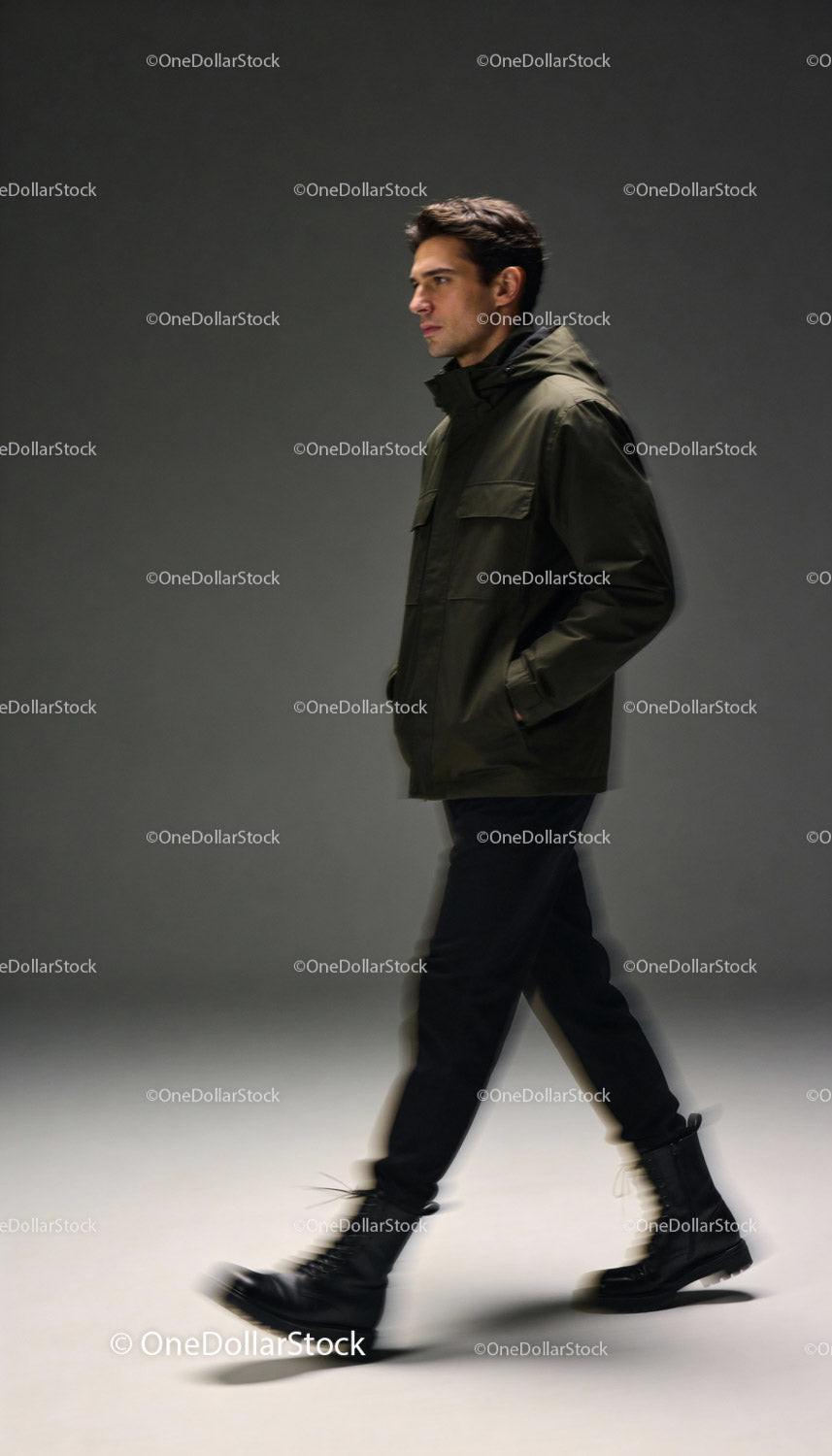 Man Walking Confidently in Casual Urban Jacket and Boots