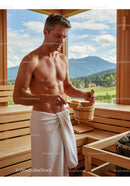 Relaxing Shirtless Man in Wooden Sauna with Mountain View Scene