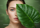 Beautiful Woman with Green Leaf and Dew Drops Close-Up