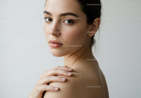 Elegant Woman with Clear Skin and Expressive Eyes in Professional Portrait