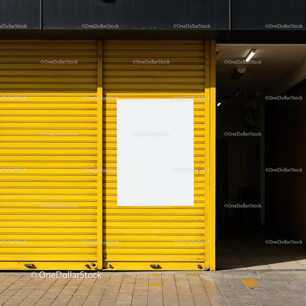 Empty white poster on vibrant yellow shutter door JPG Mockup Image