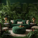 Elegant green velvet sofa with lush tropical plants interior